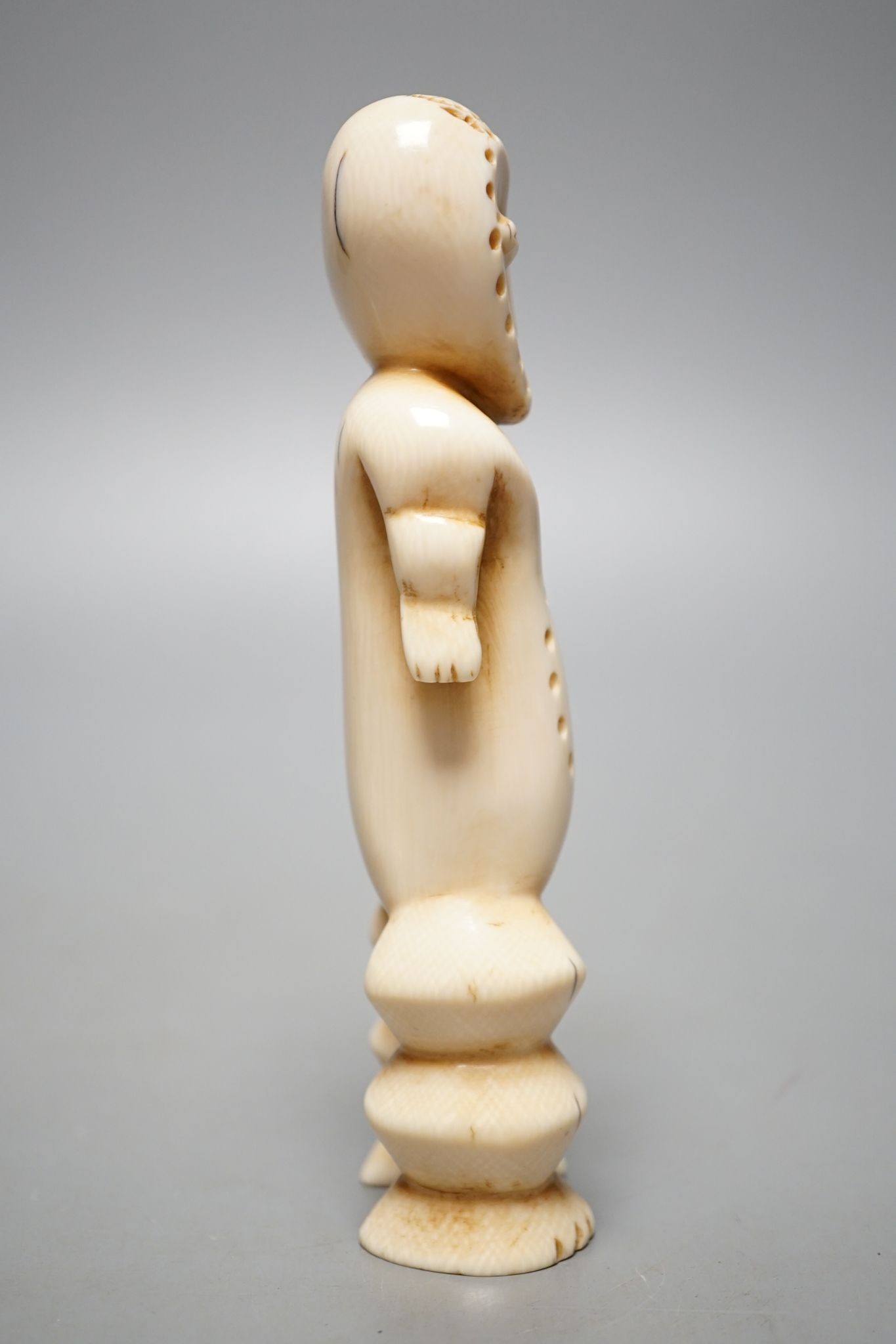 A Lega ivory figure, 15 cms high.